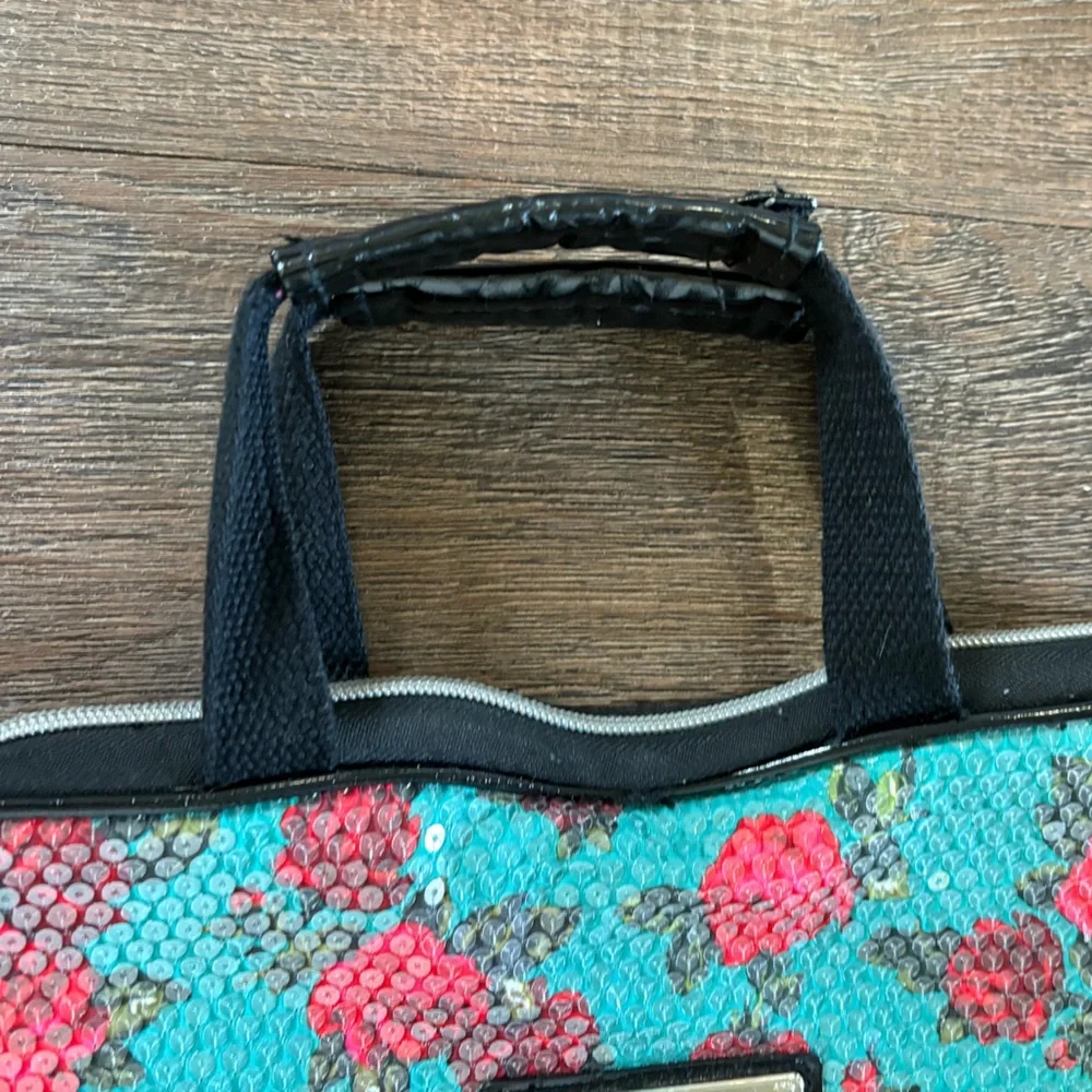 Betsey John turquoise and floral fully clear sequined bag.